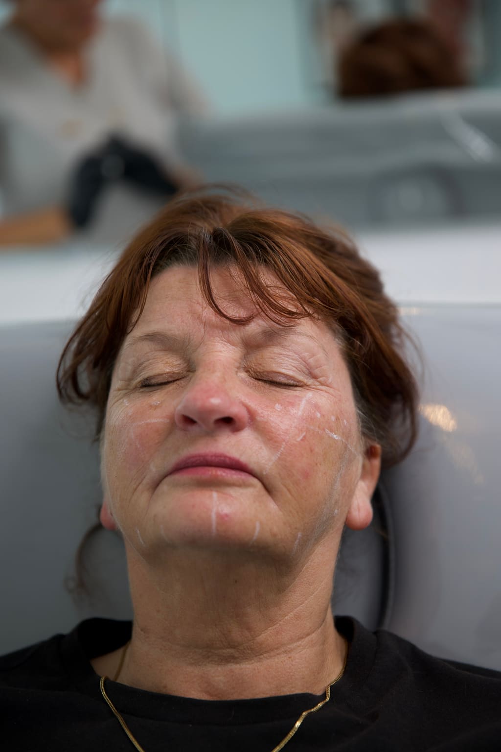 A client resting during a facial treatment at Maldiva Aesthetics
